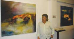 Robert Mihagui and his works atthe Homeland Colors: West&East exhibition now in HCM City. — Photo Sunny Rose